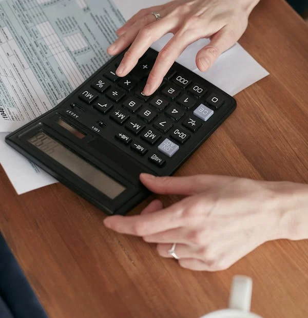 A calculator being used to calculate property values